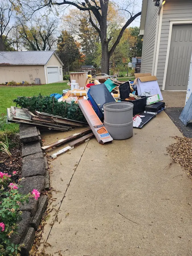 Dumpster being loaded with debris for Estate Cleanout Dumpster Rental in Lexington Park